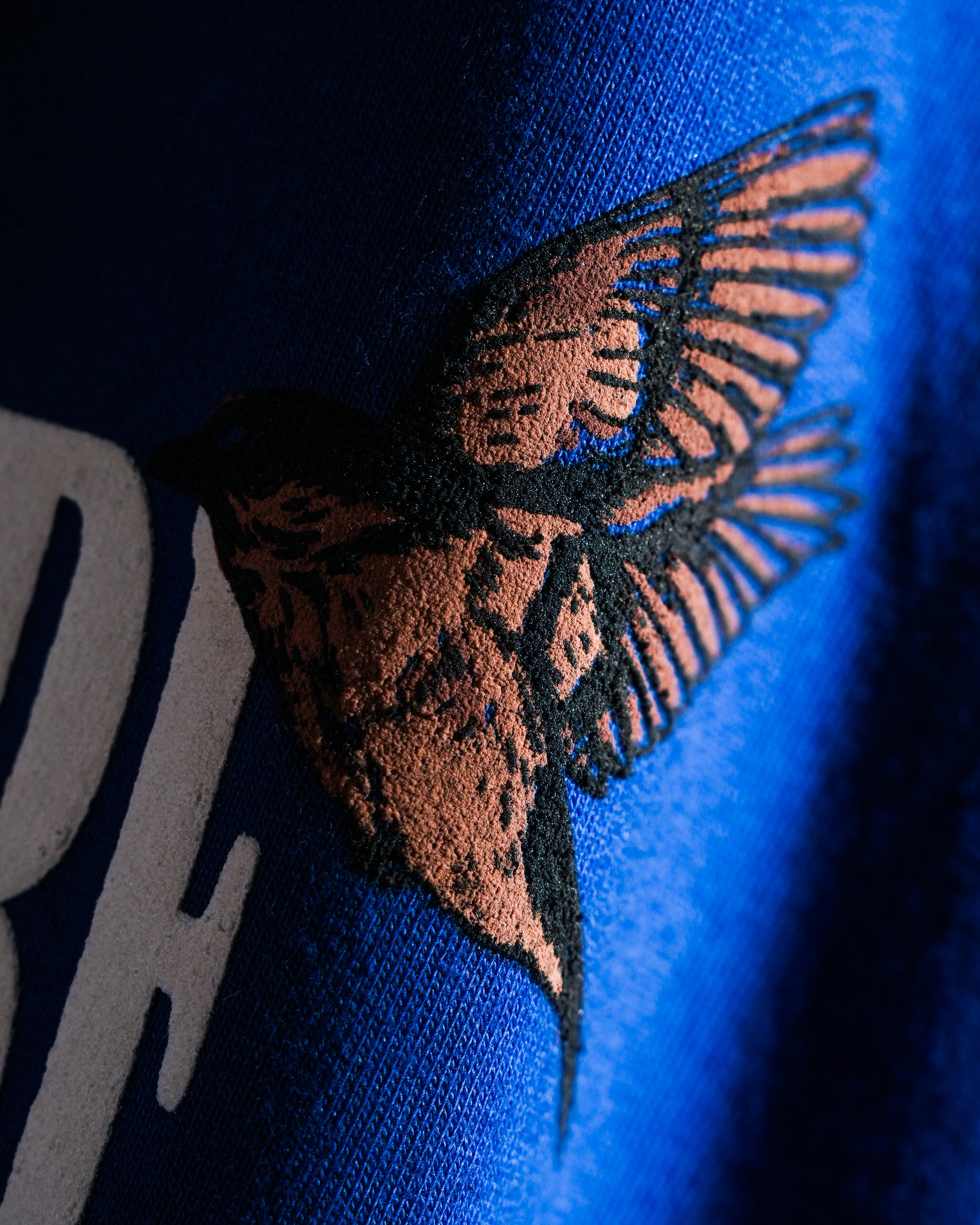 THE SPARROW TEE